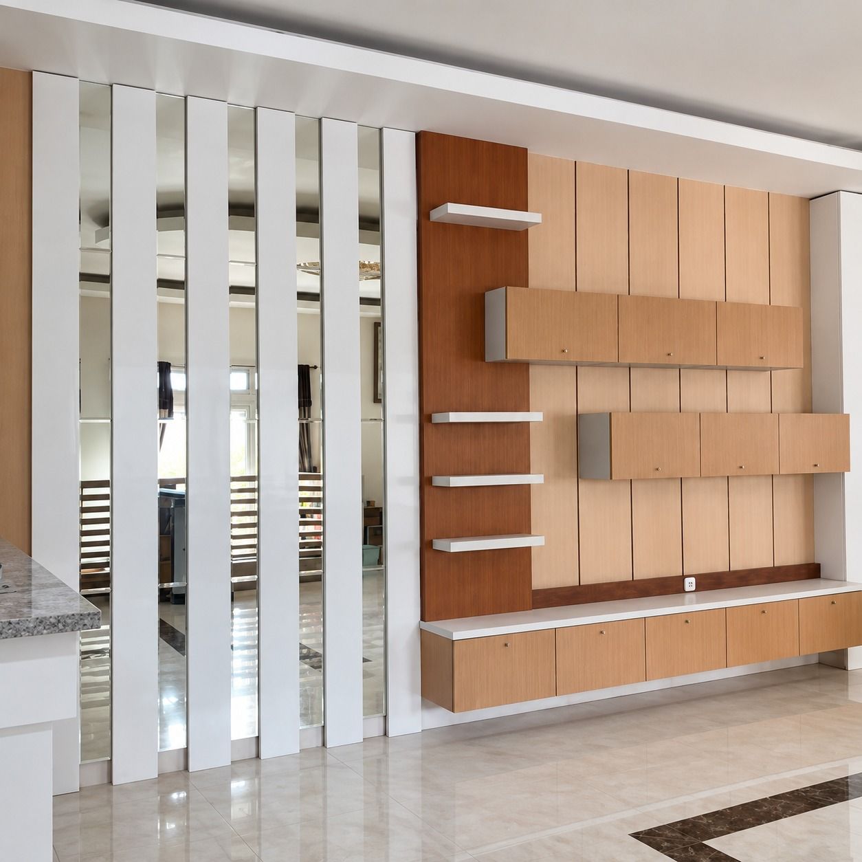 Partisi bilah putih di samping dinding TV berpanel motif kayu terang, kabinet gantung, rak putih, dan meja TV panjang.